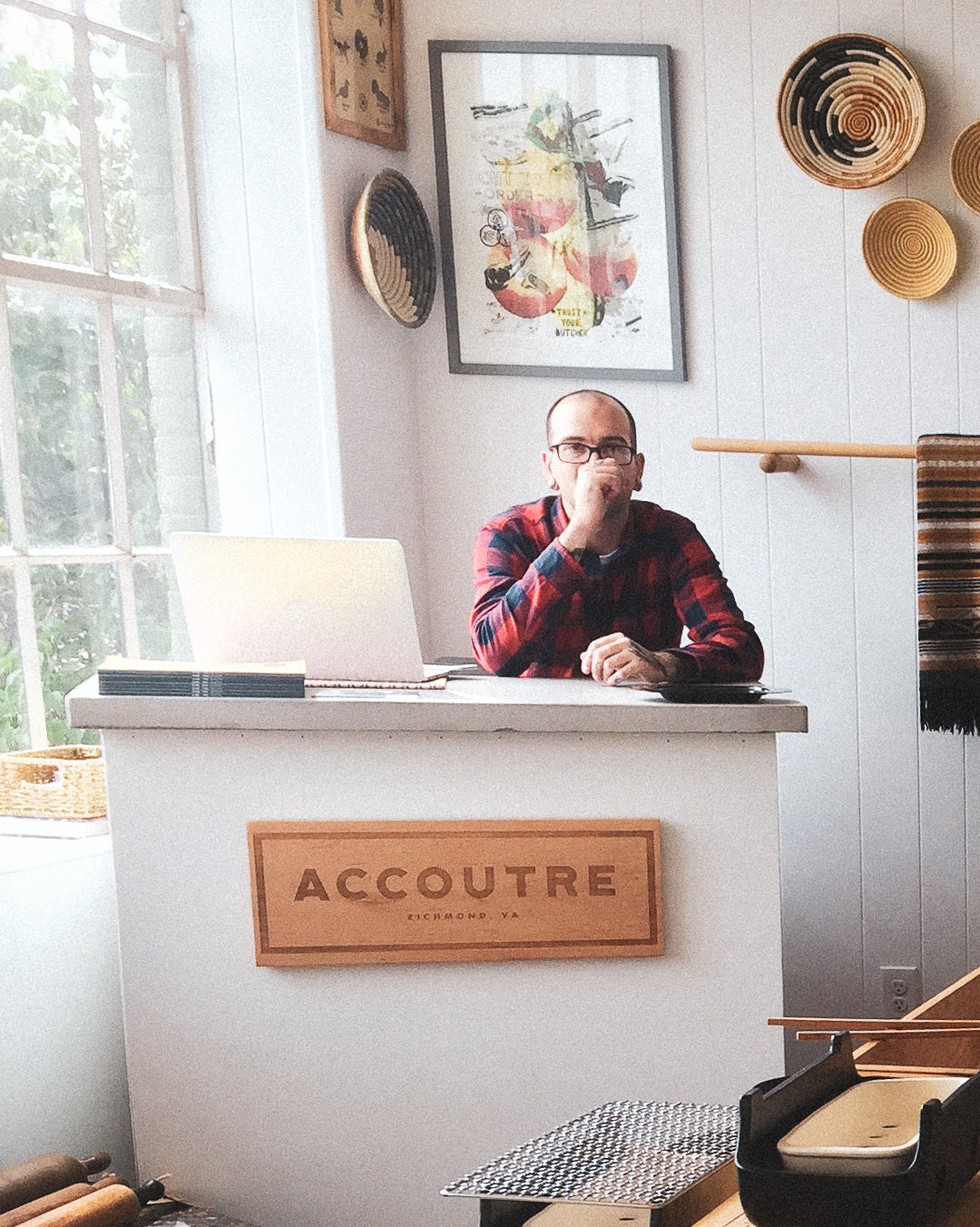 Portrait of owner of Accoutre Rob Bland at cash wrap