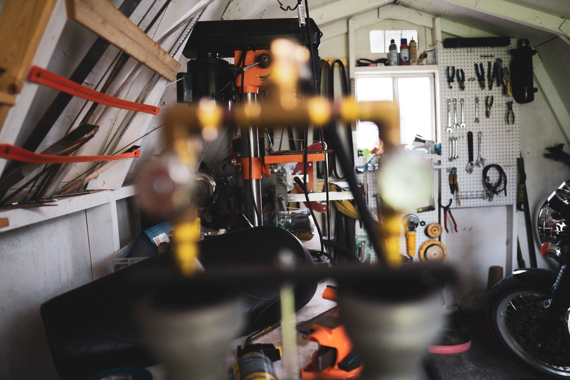 Workshop shot through forge burners foreground.