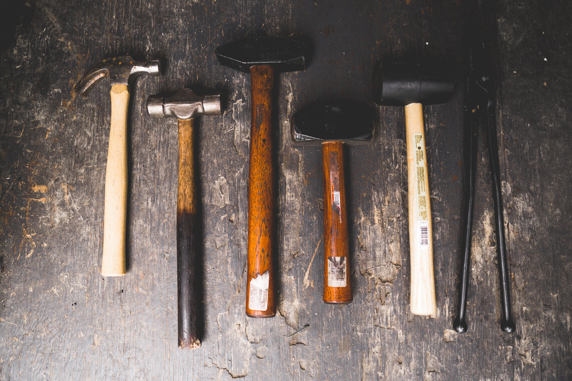 Overhead shot of array of hammers and tong
