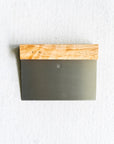 Metal tool with wooden handle on a white background